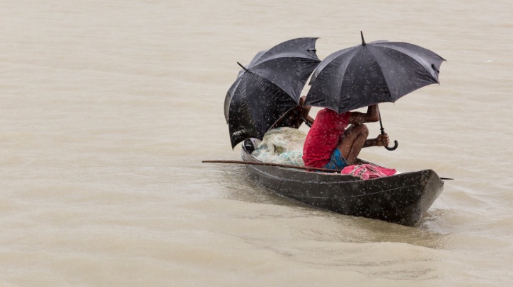 Caltech uses machine learning to improve monsoon rainfall predictions Men in a wooden canoe sheltering under umbrellas from the monsoon rain, in Bangladesh.