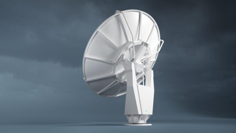 A dual-polarization C-band weather radar sits against a cloudy backdrop.