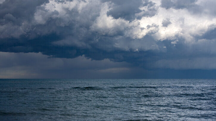 Oceans hit record-high temperatures for July, Copernicus reports A storm takes shape over the sea. The light is low and the waves are building.