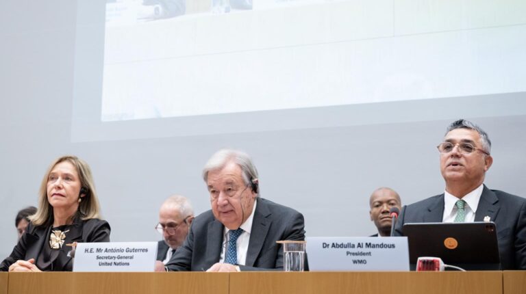 WMO Endorses next phase of Global Greenhouse Gas Watch Prof. Celeste Saulo, WMO Secretary-General; António Guterres, Secretary-General of the United Nations; Dr Abdulla Al Mandous, WMO President sit at a desk at the WMO Extraordinary World Meteorological Congress meeting with a large projector screen behind them