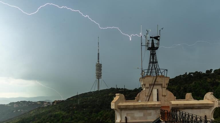 Number of countries with multi-hazard early warning systems reaches record high, says UN and WMO report A storm moves over a hill, with lightning moving across the sky and a weather station in the foreground