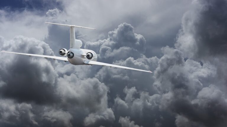 MIT-developed lightning prediction tool targets safety of future aircraft A twin-engine business jet flies towards dark grey storm clouds