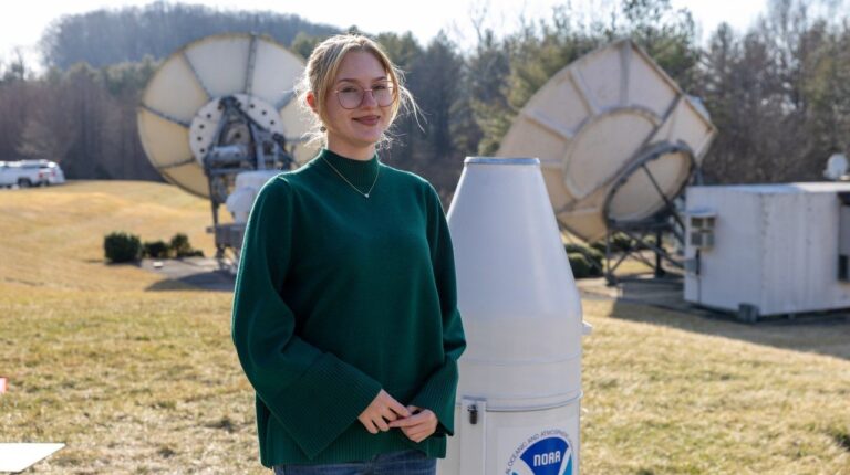 McKenzie Tate, student at Virginia Tech, with a NOAA rain gauge.
