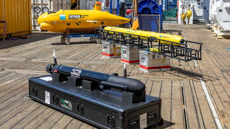 Sonardyne provides navigation support to BAS GIANT climate mission studying Greenland’s glaciers AUVs on the aft deck of the RRS Sir David Attenborough ahead of its GIANT mission. Pictured are Autosub Long Range, a Teledyne Gavia and an ecoSUB Robotics AUV. Credit: Sonardyne.